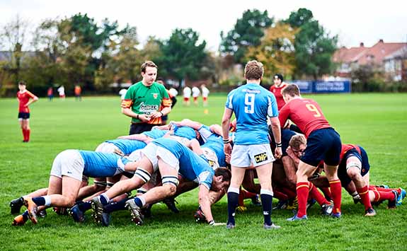 Rugby players in a scrum formation